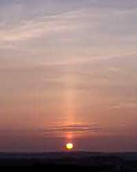 Sun pillar above setting sun at 1823 GMT on 21 March 2003. View from Gaerwen towards Holyhead. Photo: &copy; D Perkins.